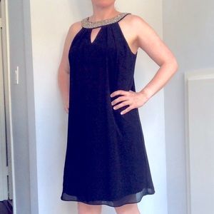 Black cocktail dress with beading.
